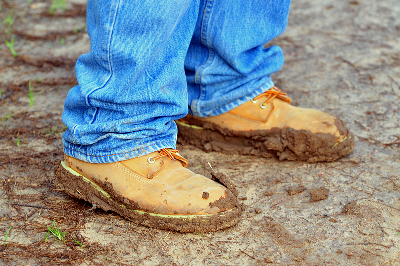 walking shoes coated in mud